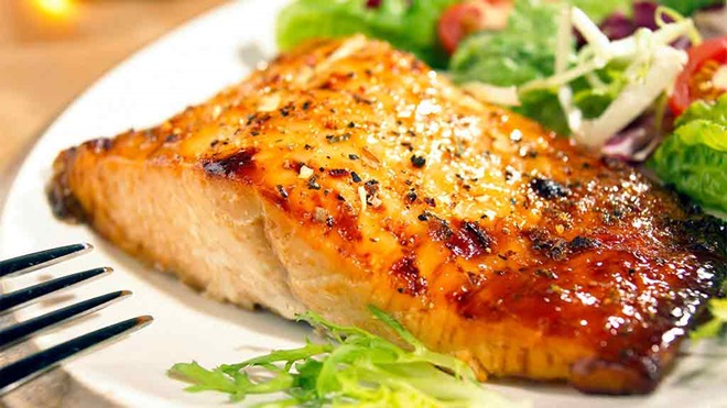 healthy looking glazed salmon with salad